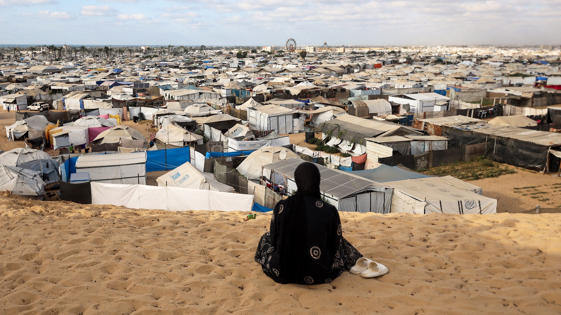 A woman overlooks a camp for displaced people in the southern Gaza Strip, on September 29, 2025, as the conflict between Israel and Hamas continues.